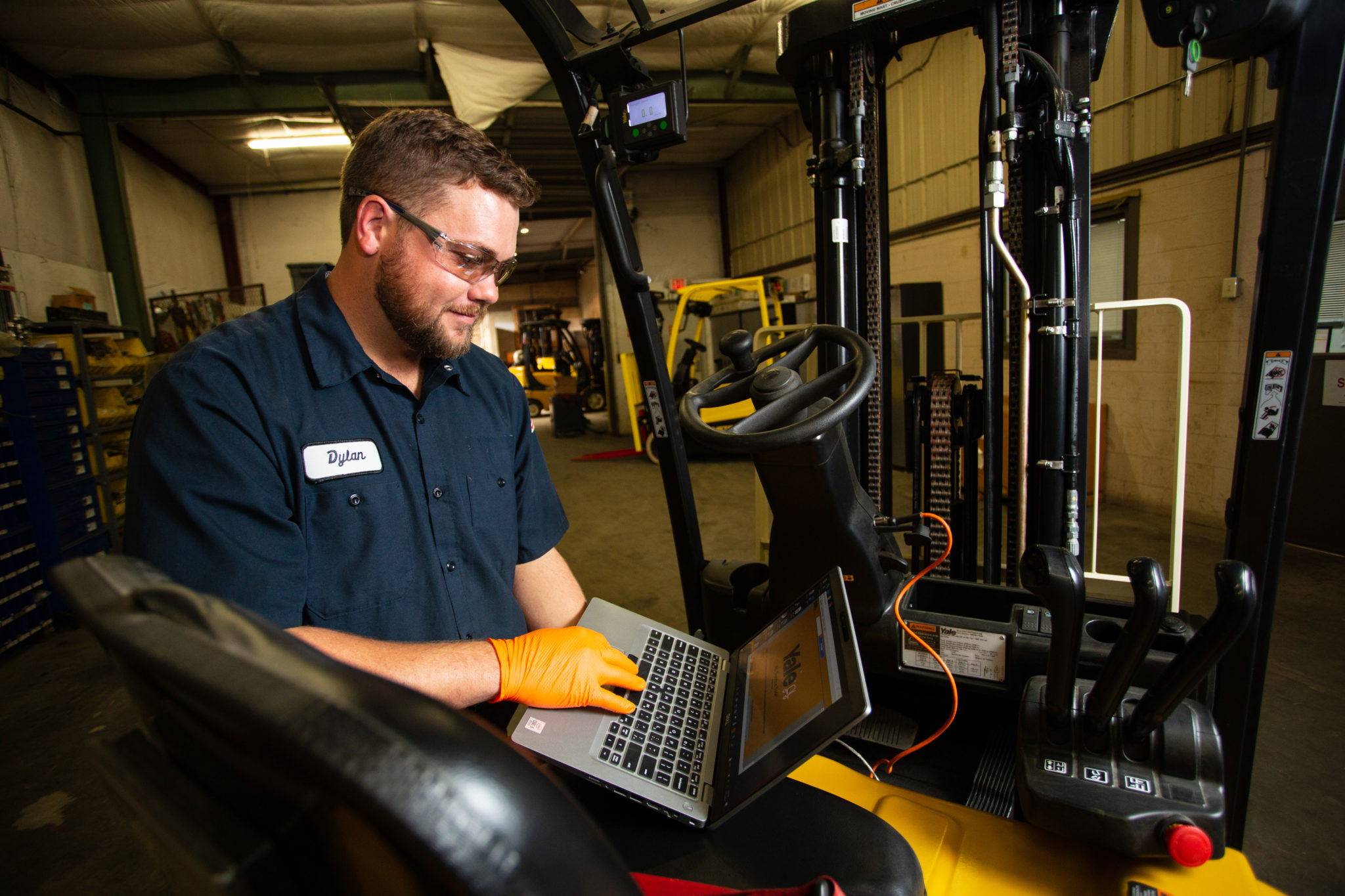 Technician Working On Yale Forklift